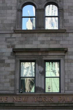St. Patrick's Cathedral reflected in New York Palace Hotel
