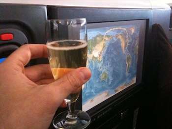 Champagne and a personal TV in business class on Cathay Pacific make for a great way to pass the time en route to Hong Kong.