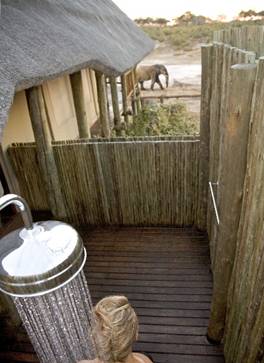 Perhaps you'll spy an elephant walking by while showering at Savute Elephant Camp, Botswana, Africa