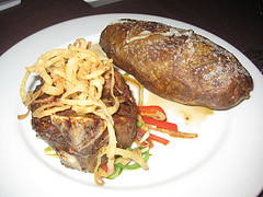 Palace Resort Mignon's Bone-in Filet and baked potato, Nancy D. Brown photo Palace Resort Mignon's Bone-in Filet and baked potato, Nancy D. Brown photo